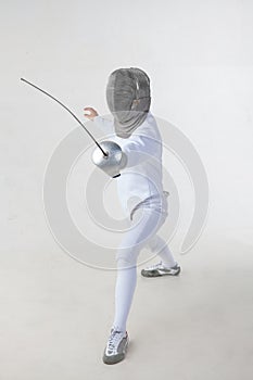 Female fencer isolated on white background