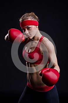 Female fighter in red gloves