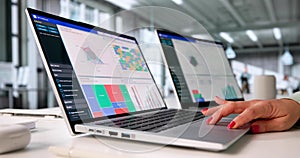 Female Financial Analyst Analyzing Market Data On Laptop