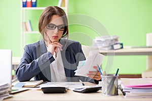 The female financial manager working in the office