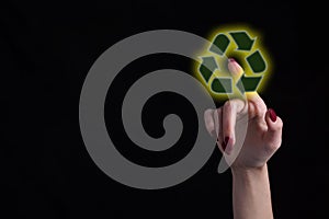Female finger touching recycle eco icon, symbol of earth day