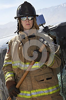 Female Firefighter Holding Axe