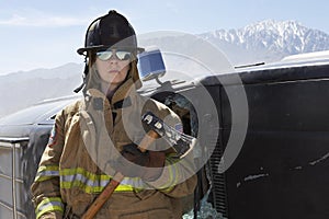 Female Firefighter Holding Axe