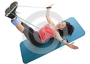 Female with fitness expander in stretching