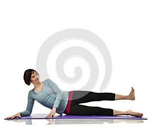 Female fitness instructor doing stretching for hands legs abdominals bar exercise in gym work out isolated on white
