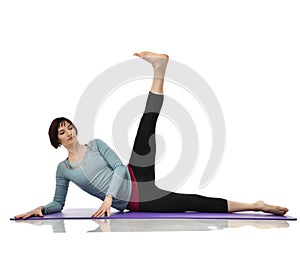 Female fitness instructor doing stretching for hands legs abdominals bar exercise in gym work out isolated on white