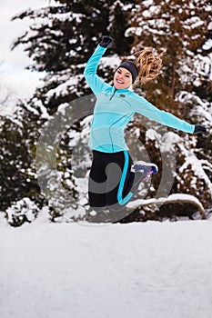 Female fitness sport model outdoor in cold winter weather