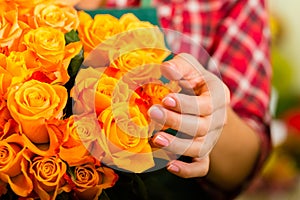 Female florist in flower shop