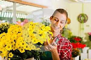 Female florist in flower shop