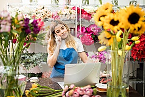 Female florist making a call at work