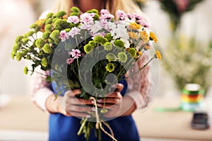 Female florist working in flower shop