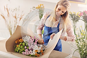 Female florist working in flower shop