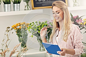 Female florist working in flower shop