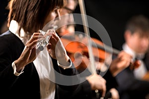 Female flutist performing photo