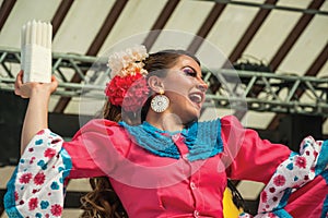 Female folk dancer performing a typical dance
