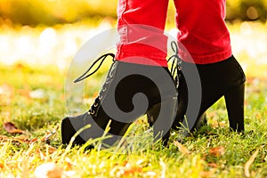 Female foot in elegant black shoes.