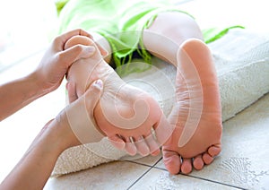 Female foot reflexology in spa