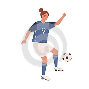 Female football player kicking ball by foot. Young woman playing soccer in blue sports clothes, boots and stockings