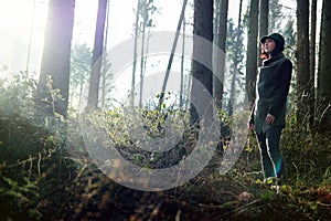 Female forester at work, watching the forest