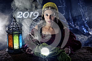 Fortune Teller Making Predictions for New Year 2019 photo