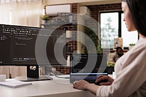 Female freelance developer coding html script