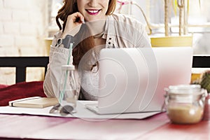 Female freelancer in coffee shop photo