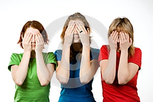 Female friends covering eyes