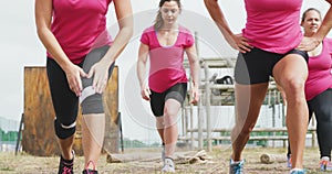 Female friends enjoying exercising at boot camp together