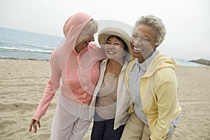 Female Friends Enjoying Vacation At Beach