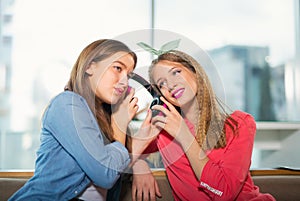 Female friends listening to music together