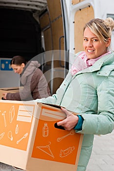 Female friends loading a moving truck