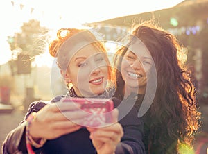 Female friends two women taking selfie having fun during weekend getaway