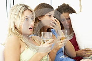 Female Friends Watching A Scary Movie
