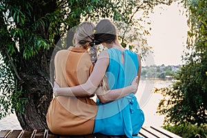 Female friendship femininity, diverse, support, partnership, girlfriend concept. Two girls blonde, brunette, with braided plait