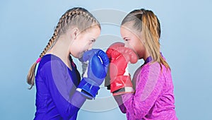 Female friendship. Girls in boxing sport. Boxer children in boxing gloves. Girls cute boxers on blue background