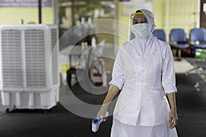 Female frontliner performing her tasks during the coronavirus pandemic.