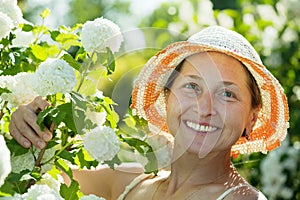 Female gardener in Roseum plant