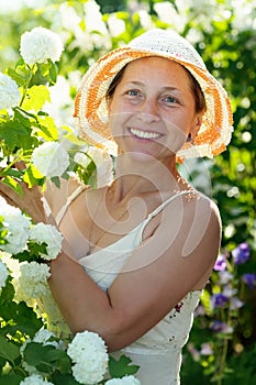 Female gardener in Roseum plant