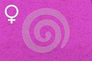 Female gender symbol Venus sign over pink uneven texture background. photo