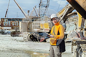 Female geologist or mining engineer at work