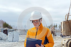 Female geologist or mining engineer at work