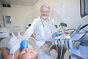 Female getting thyroid ultrasound exam at clinic