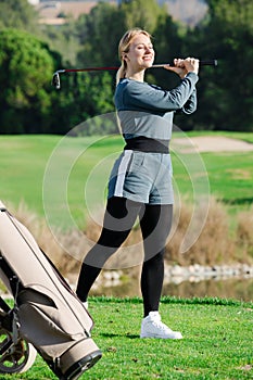 Female golf player is succeeded in ball hitting