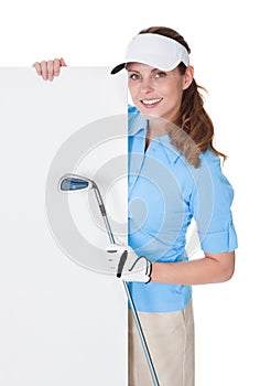 Female golfer with blank board photo