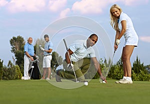 Female golfer learning to putt