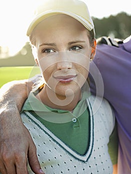 Female Golfer With Male Friend