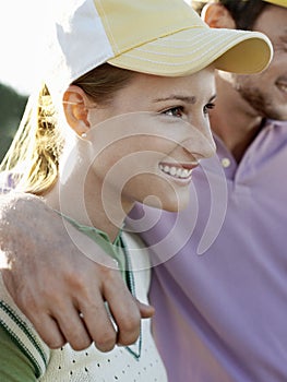 Female Golfer With Male Friend