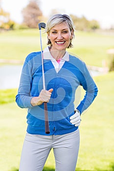 Female golfer smiling at camera