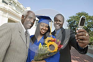 Female Graduate With Family Taking Selfportrait