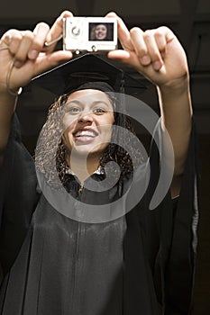 Female graduate taking a self portrait